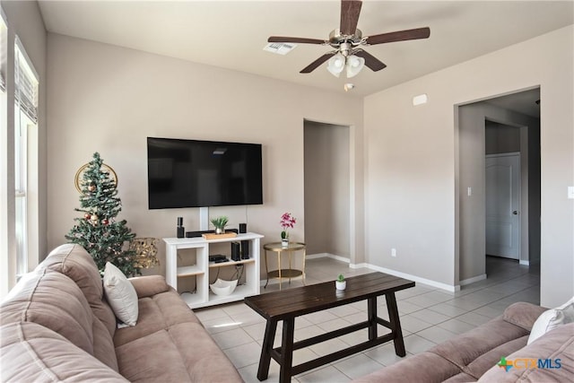 living room featuring ceiling fan and light tile patterned flooring