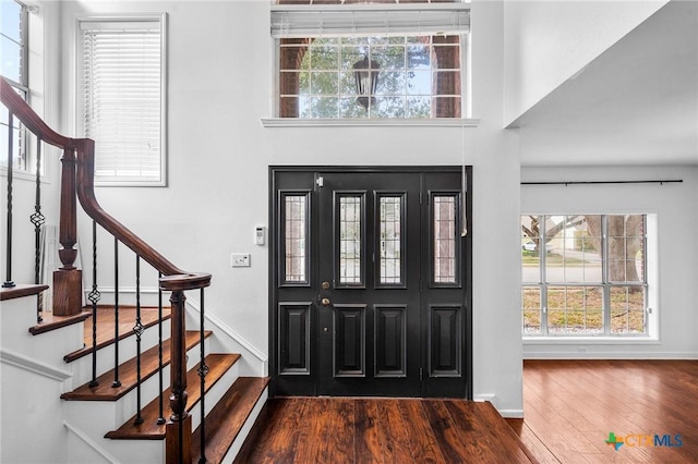 entrance foyer featuring dark hardwood / wood-style flooring