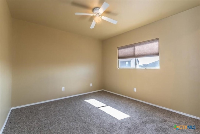 spare room featuring ceiling fan and carpet floors