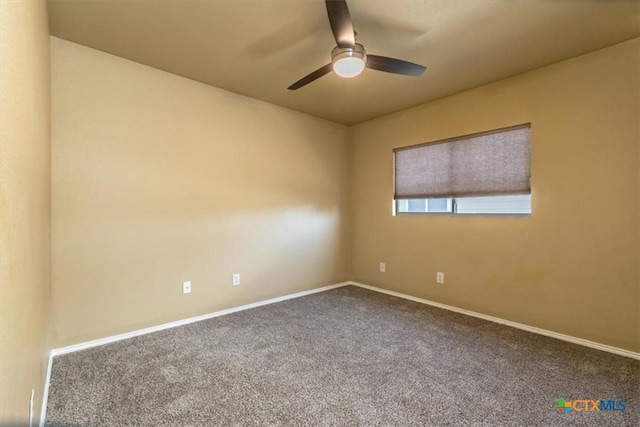 empty room featuring carpet flooring and ceiling fan