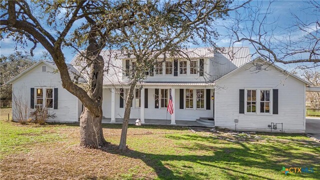 408 Frobese St, Cuero, TX 77954 - view of front facade with covered porch and a front yard