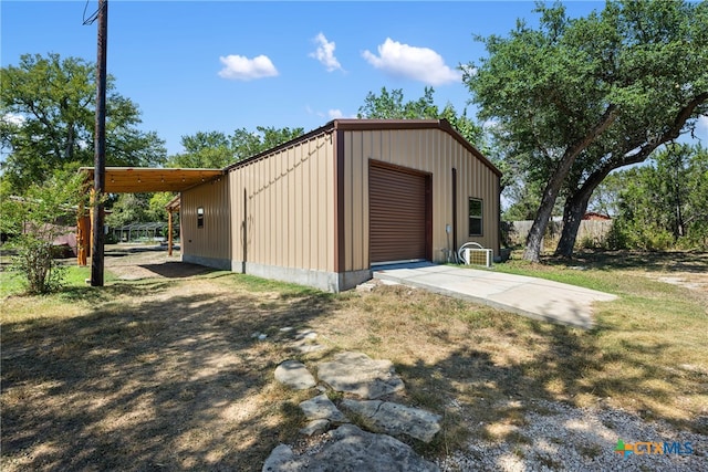 view of outbuilding featuring a garage