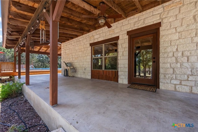 view of patio / terrace featuring ceiling fan