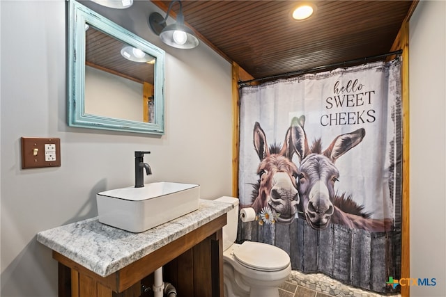 bathroom with toilet, wood ceiling, vanity, a shower with shower curtain, and tile patterned flooring