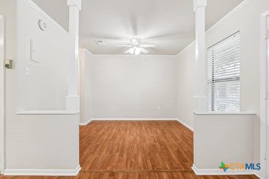 1624 Aquarena Springs Dr Unit G152, San Marcos, TX 78666 - unfurnished room with a ceiling fan, wood finished floors, baseboards, and crown molding