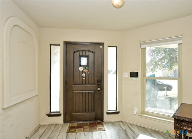 foyer entrance featuring light wood-style floors