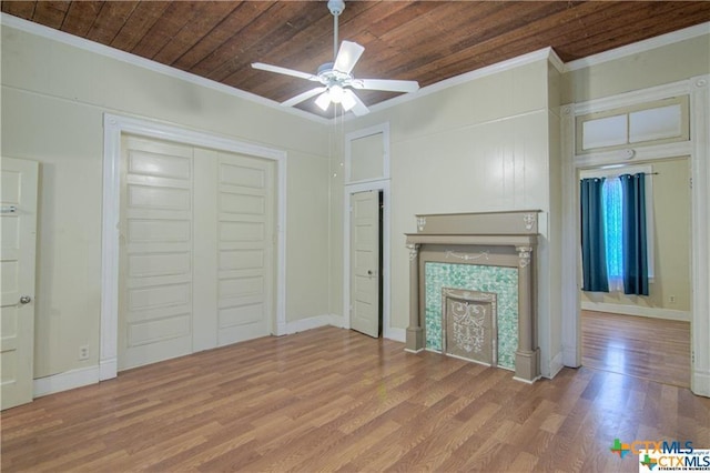 unfurnished living room featuring crown molding, ceiling fan, and light hardwood / wood-style flooring