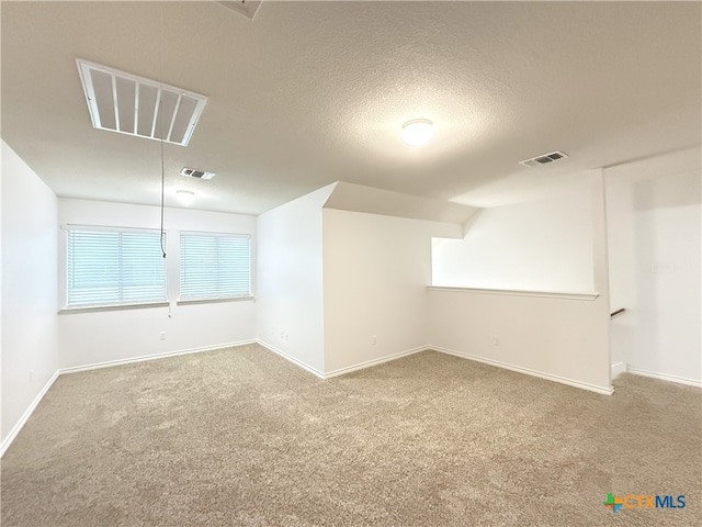 3312 Vineyard Trl, Harker Heights, TX 76548 - carpeted spare room with baseboards and a textured ceiling