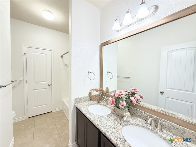 3312 Vineyard Trl, Harker Heights, TX 76548 - bathroom featuring double vanity, tile patterned flooring, and washtub / shower combination