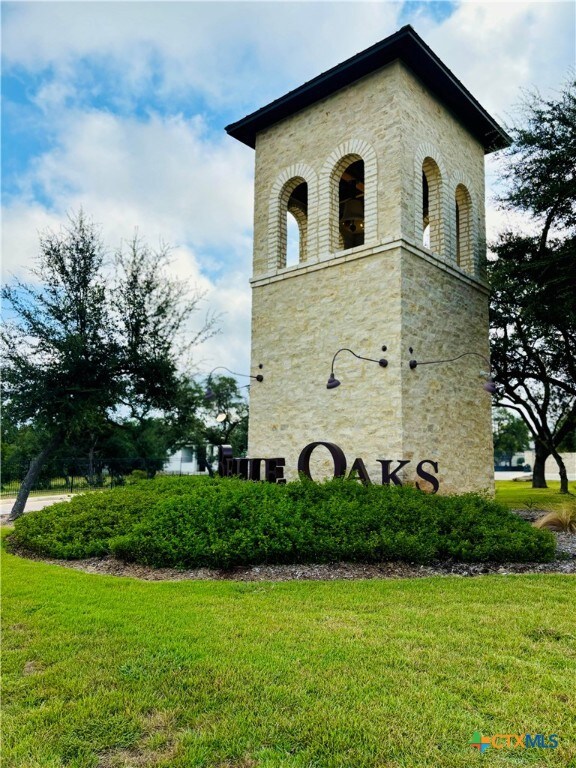 view of property exterior featuring a lawn