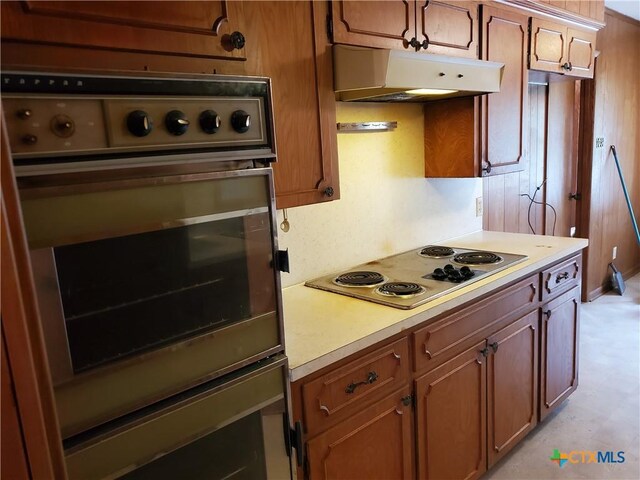 18581 State Highway 53, Temple, TX 76501 - kitchen featuring electric cooktop, oven, light countertops, and under cabinet range hood