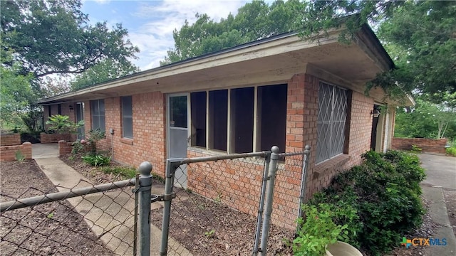 18581 State Highway 53, Temple, TX 76501 - view of side of home featuring brick siding and a sunroom