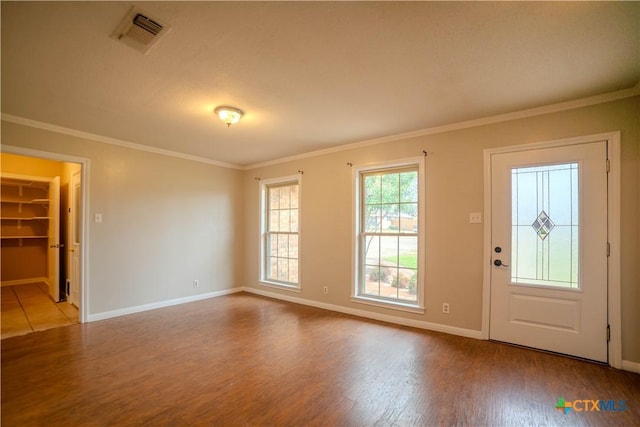 foyer featuring crown molding and wood-type flooring