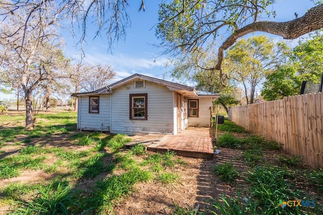 210 S Monterey St, Smiley, TX 78159 - rear view of house with a wooden deck