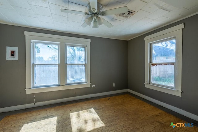 210 S Monterey St, Smiley, TX 78159 - unfurnished room with plenty of natural light, a ceiling fan, and wood finished floors