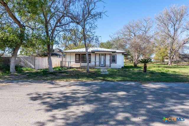 210 S Monterey St, Smiley, TX 78159 - view of front of property featuring a porch and a metal roof
