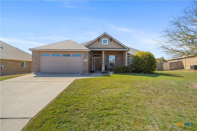 craftsman inspired home featuring driveway, an attached garage, fence, a front yard, and brick siding