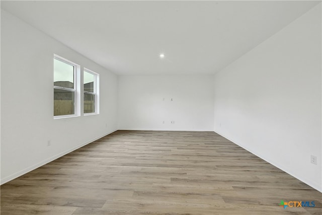 spare room featuring light hardwood / wood-style floors