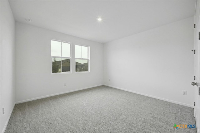 empty room with carpet flooring