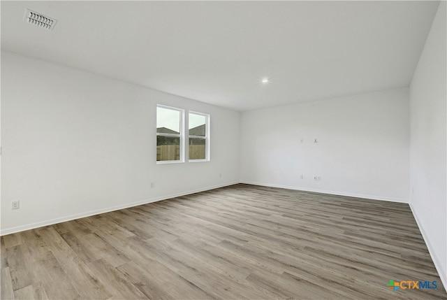 empty room featuring light hardwood / wood-style floors