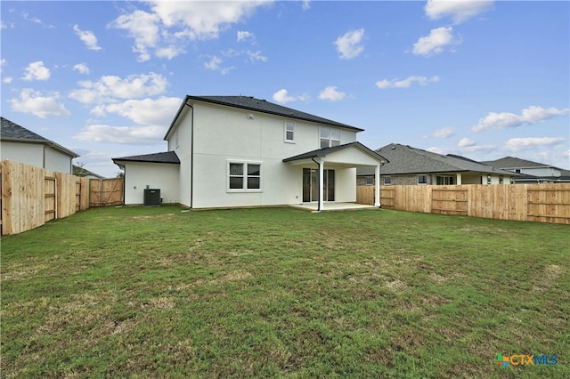 back of house with a lawn, a patio, and central AC unit