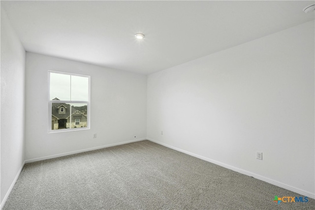 unfurnished room with carpet floors