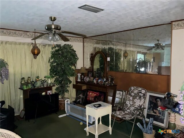 404 Svoboda St, Yoakum, TX 77995 - living area with ceiling fan and a textured ceiling