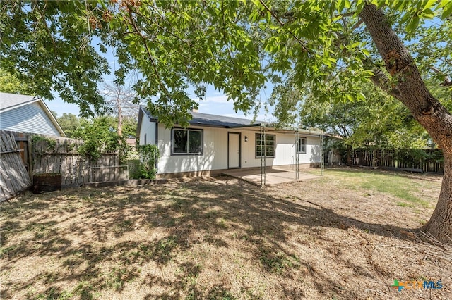 back of property featuring a patio