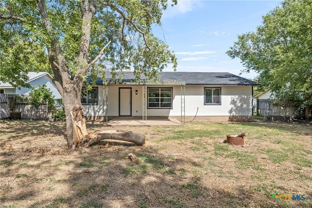 rear view of property featuring a patio area