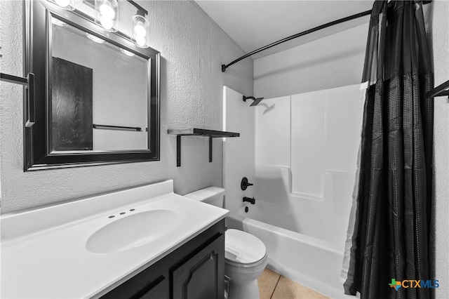 full bathroom with vanity, shower / tub combo with curtain, tile patterned floors, and toilet