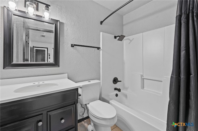 full bathroom with tile patterned floors, vanity, shower / bath combo, and toilet