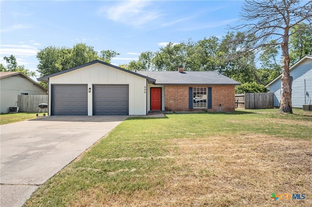 ranch-style house with a garage and a front yard