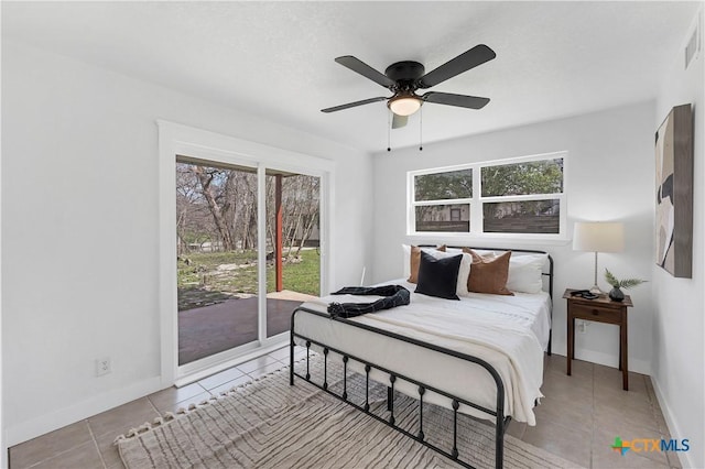 bedroom featuring light tile patterned floors, a ceiling fan, visible vents, baseboards, and access to outside