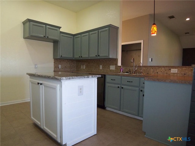 kitchen featuring decorative backsplash, sink, light tile patterned floors, stone countertops, and hanging light fixtures