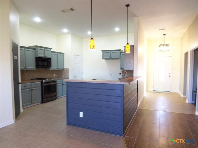 kitchen with pendant lighting, sink, decorative backsplash, electric range oven, and kitchen peninsula