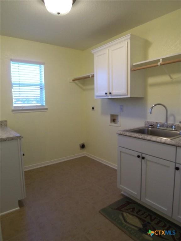 laundry room with cabinets, sink, washer hookup, and hookup for an electric dryer