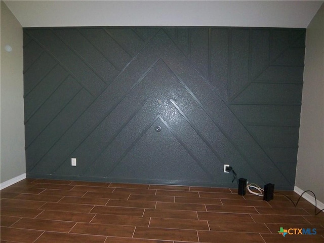 spare room featuring dark hardwood / wood-style floors