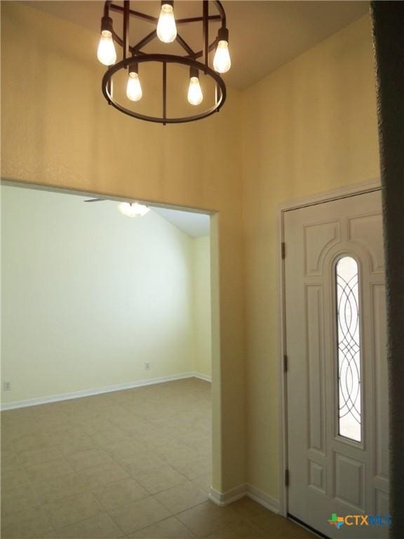 foyer entrance featuring an inviting chandelier