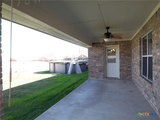 view of patio / terrace with a fenced in pool