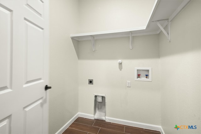 washroom with dark hardwood / wood-style flooring, electric dryer hookup, hookup for a washing machine, and gas dryer hookup