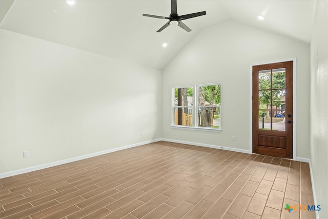 unfurnished living room featuring high vaulted ceiling, hardwood / wood-style flooring, and ceiling fan