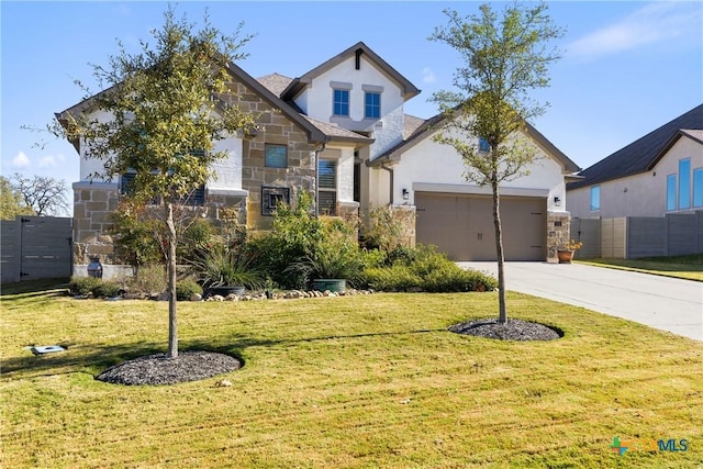 view of front of home with a garage and a front lawn