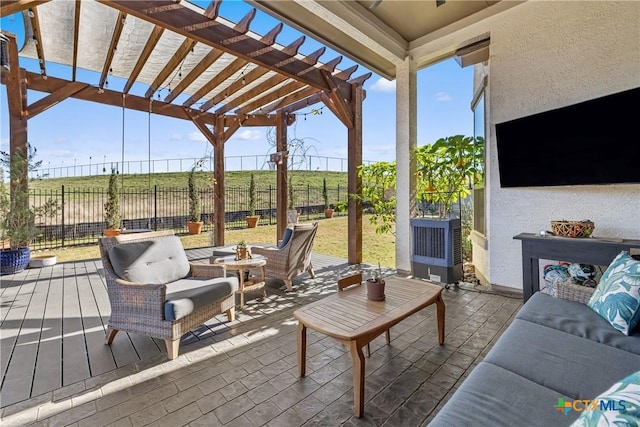 view of patio featuring a pergola and a wooden deck