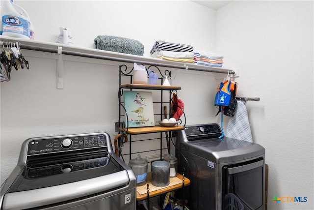 washroom with washing machine and dryer