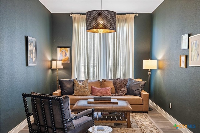 living room with a healthy amount of sunlight and wood-type flooring