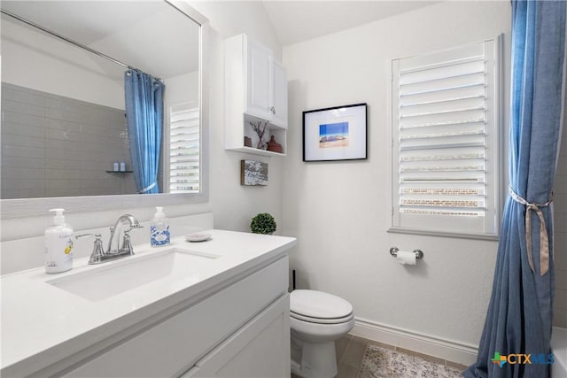 bathroom with a shower with curtain, vanity, and toilet