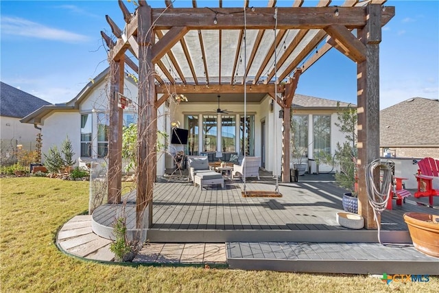 exterior space with outdoor lounge area, a pergola, a deck, and ceiling fan