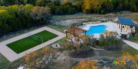 view of pool featuring an outbuilding