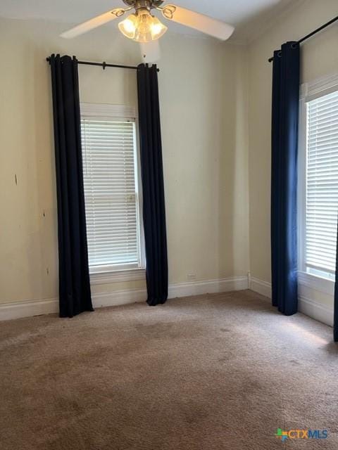 716 Josephine St, Yoakum, TX 77995 - carpeted spare room featuring ceiling fan and baseboards