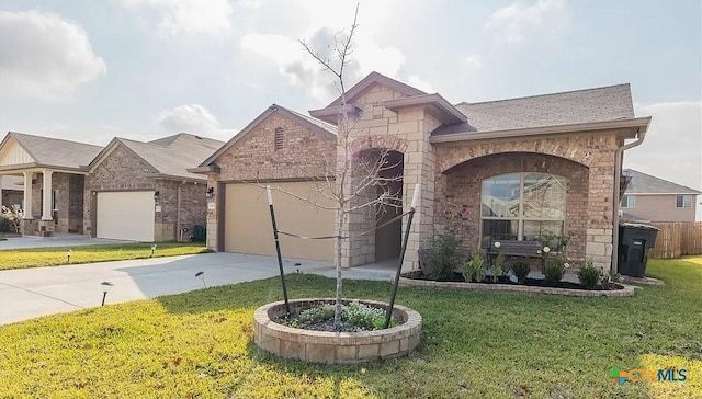 view of front of property featuring a garage and a front lawn